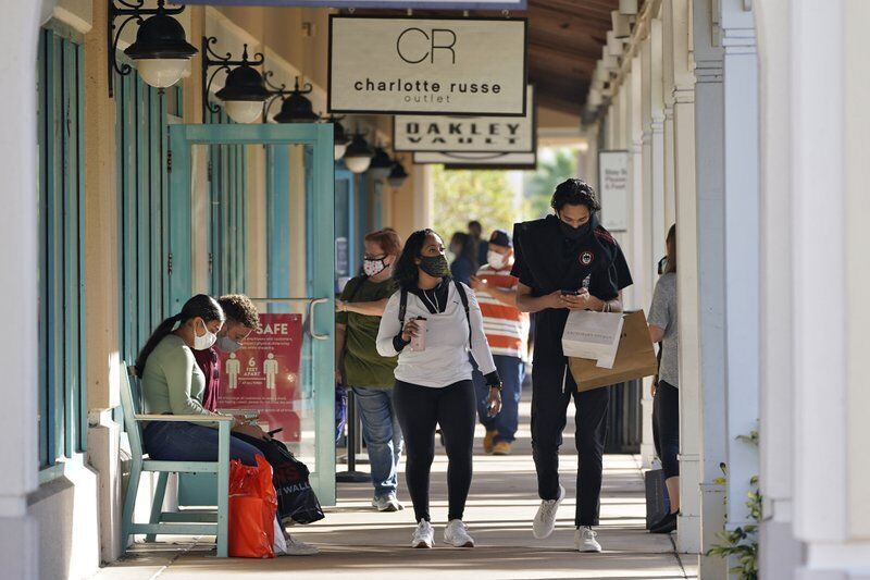 Virus keeps Black Friday crowds thin, shoppers shift online